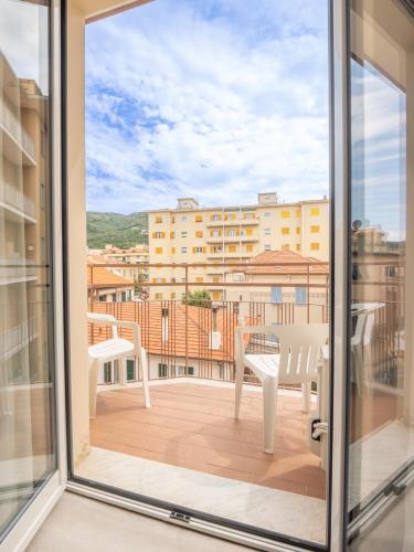 a balcony with a table and chairs and a view at Hotel La Bussola in Finale Ligure