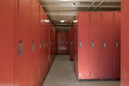 a row of red lockers in a locker room at Holiday Inn Express & Suites Tremblant by IHG in Mont-Tremblant