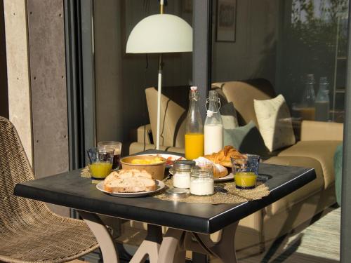 a black table with food and drinks on it at Alto da Pousa in Tomiño