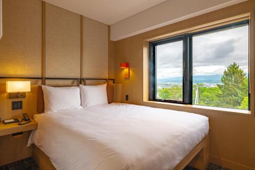 Nozo Hotelにあるベッド