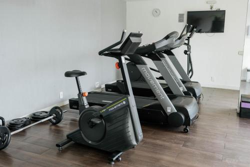 a gym with three exercise bikes in a room at Hotel Orizzonte Niteroi by Atlantica in Niterói