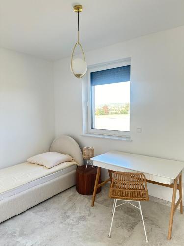 Ένα ή περισσότερα κρεβάτια σε δωμάτιο στο Apartament Sarnia