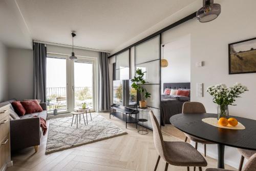 Χώρος καθιστικού στο Come in! "Kakola" Room for 3 in idyllic renovated prison area in Turku centrum!