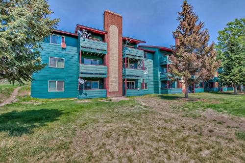 a colorful building with a tree in front of it at Summit Serenity in Dillon