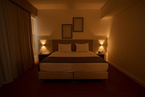 Un ou plusieurs lits dans un hébergement de l'établissement Go Inn Goiana by Atlantica Hotels
