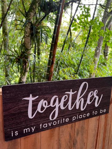 a sign that reads together is my favorite place to be at Cabaña & glamping para grupos de 4 a 6 personas, cerca al parque y con avistamiento de aves in Jardin
