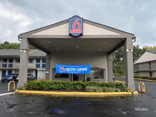 a new open sign in front of a new office at Studio 6 Suites Charlotte, NC Northlake in Charlotte