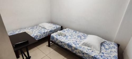 Postel nebo postele na pokoji v ubytování Guayacan Hostel