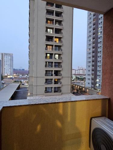 a view of a building from the balcony of a building at Edifício Belluno in Ribeirão Preto