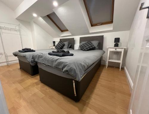 a bedroom with a large bed in a room at Cosy Penthouse suite happily sleeps up to five in Halifax
