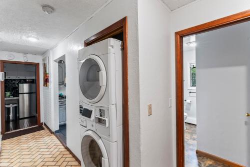a washer and dryer in a room with a doorway at Quiet And Comfortable Deluxe in Anchorage