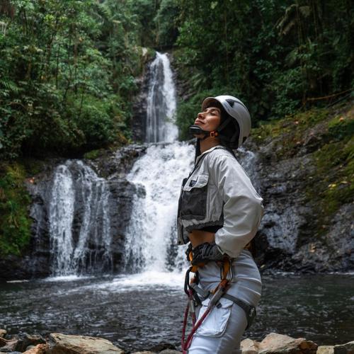 a man standing in front of a waterfall at Termales Santa Rosa De Cabal in Santa Rosa de Cabal