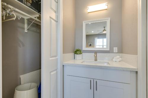 a bathroom with a sink and a mirror at 6 Mi to Coachella Festival Serene Studio in Indio