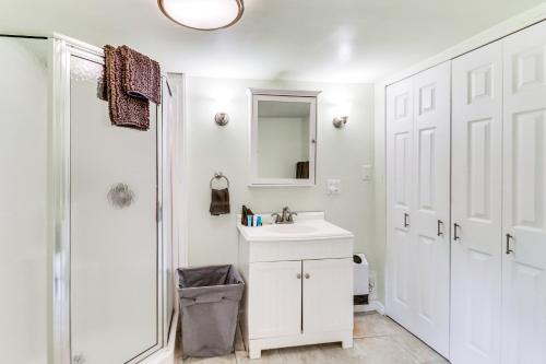 a white bathroom with a sink and a shower at Walk to Beach Pet-Friendly Gem in Scotland! in Ridge