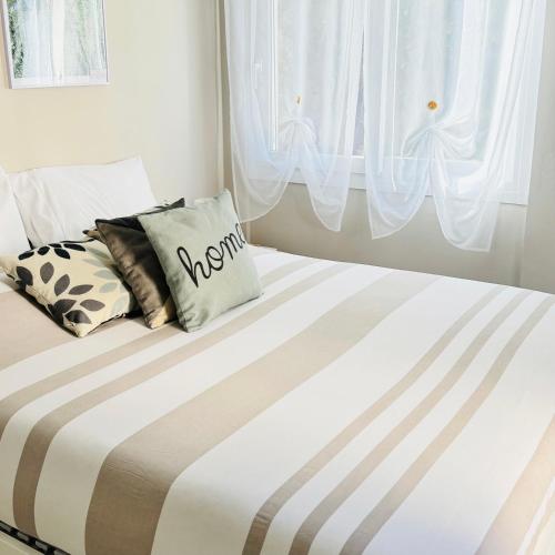 Postel nebo postele na pokoji v ubytování Casa Rosetta - Relax in Centro, Parcheggio Privato, Mare a 2 Passi