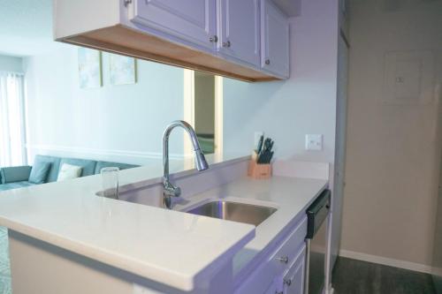 a kitchen with a sink and a counter top at Deluxe luxury & convenience in Charlotte