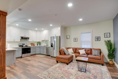a living room with a couch and a kitchen at Walk to Lititz Springs Park Cozy Getaway! in Lititz