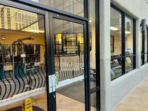 an open door of a store with glass windows at Jockey Resort Suites Center Strip in Las Vegas