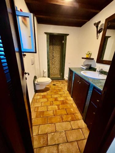 a bathroom with a toilet and a sink at Locanda delle sorelle in Campagnano di Roma