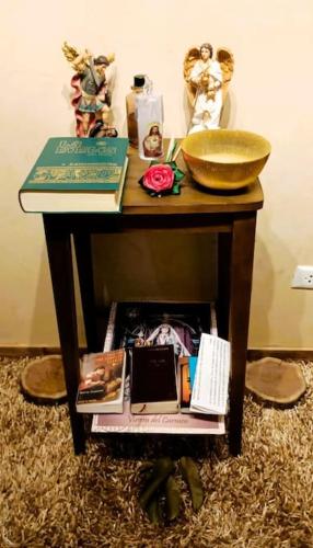 a small table with a bowl on top of it at CycIoneda House in Piura