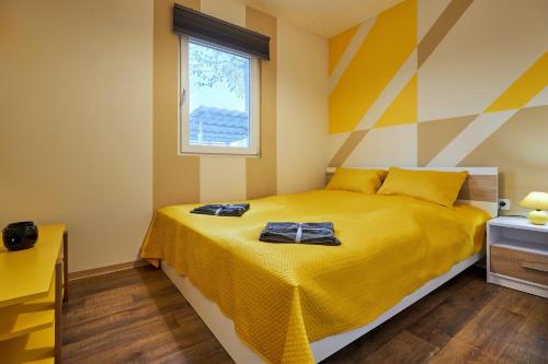 Postel nebo postele na pokoji v ubytování Bodza apartman 1 - Sarud