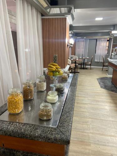 a buffet in a hotel room with food on a table at City Hotel- Mercado Publico, Prefeitura Municipal in Porto Alegre