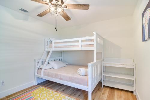 a white bunk bed in a room with a ceiling fan at Idyllic Tampa Home with Private Pool 11 Mi to Beach in Lutz