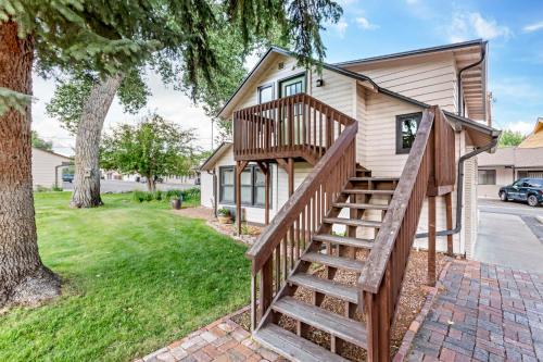 a home with a wooden staircase leading up to a house at Best Western Sunset Inn in Cody