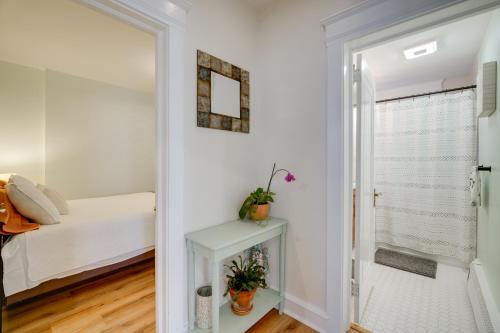 a bedroom with a bed and a door leading to a hallway at Walk to Beach Dog-Friendly Ventnor City Retreat! in Ventnor City