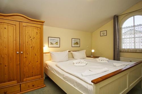 Postel nebo postele na pokoji v ubytování Strandvilla Boeck Wohnung Nr 15