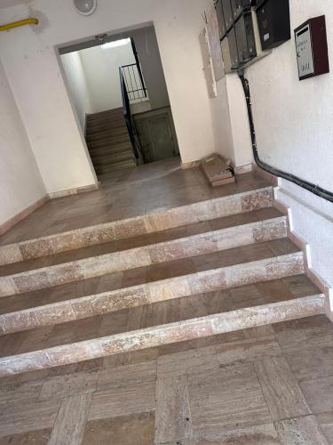 a set of stairs in a building with a door at LaMaria in Caransebeş
