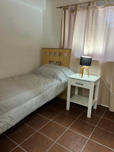 A bed or beds in a room at complejo lamadrid- departamento 2