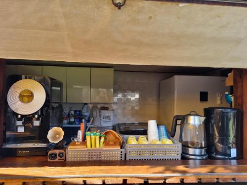 a kitchen counter top with a coffee maker and a counter top at Gohyundang in Jeonju