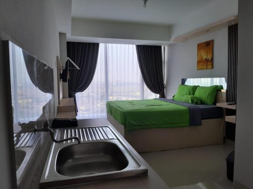 Katil atau katil-katil dalam bilik di Nature INN Majestic Point Serpong