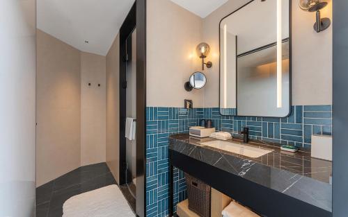 a bathroom with a sink and a mirror at Four Points by Sheraton Dali, Erhai in Dali