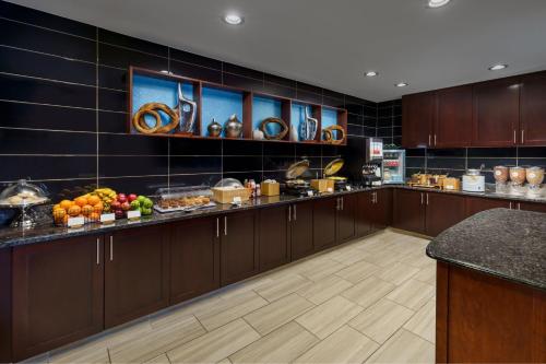 a large kitchen with a buffet of food at SpringHill Suites Manchester-Boston Regional Airport in Manchester