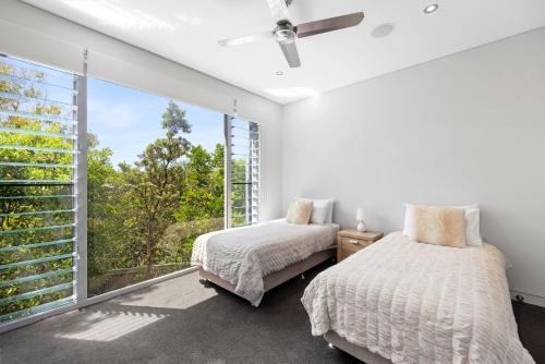 Ένα ή περισσότερα κρεβάτια σε δωμάτιο στο 32-512 David Low Way Castaways Beach