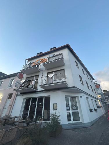 a white building with windows and balconies on it at Hotel Am Markt in Eschweiler