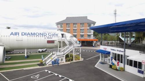 an air diamond gate airplane parked at an airport at Air Diamond Hotel in Ban Nong Khong
