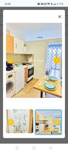 a kitchen with a table and a counter top at Pyrgos square minimal Flat near Olympia in Pýrgos