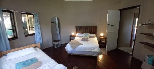 a bedroom with a bed and a couch in it at Ikaya Accommodation PSJ in Port St Johns