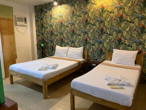 Postel nebo postele na pokoji v ubytování Lylie Hotel