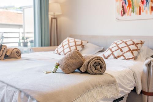 a bedroom with two beds with towels on them at STUDIO by the croisette in Cannes