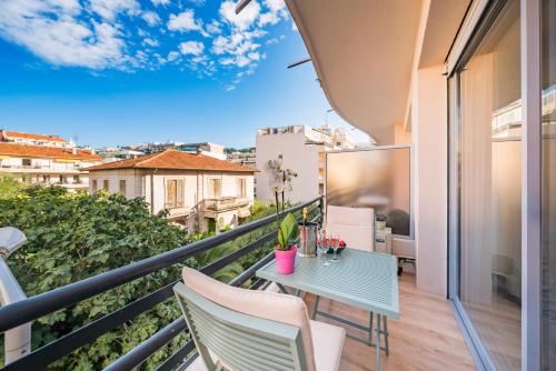 a balcony with a table and chairs on a balcony at STUDIO by the croisette in Cannes
