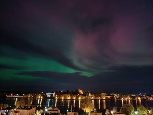 an image of a green light in the sky at night at Apartament u Ani in Iława