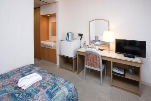Postel nebo postele na pokoji v ubytování Hotel Rubura Ohzan