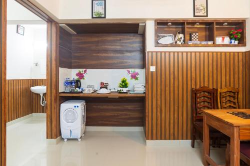 a room with a desk with a computer in it at Sancta Maria Airport Hotel in Cochin