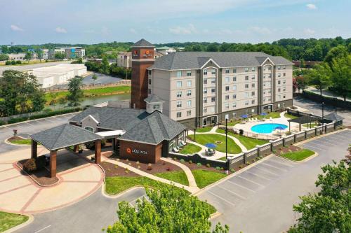 an aerial view of a hotel with a playground at La Quinta by Wyndham Greensboro NC in Greensboro