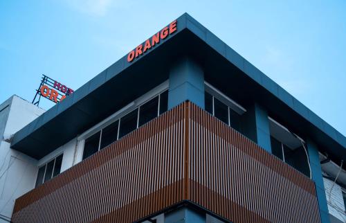 a building with a sign on top of it at Hotel Orange in Bhubaneshwar