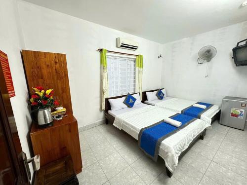 Postel nebo postele na pokoji v ubytování Blue Ocean Hotel - Thiên Thanh - sát bãi sau